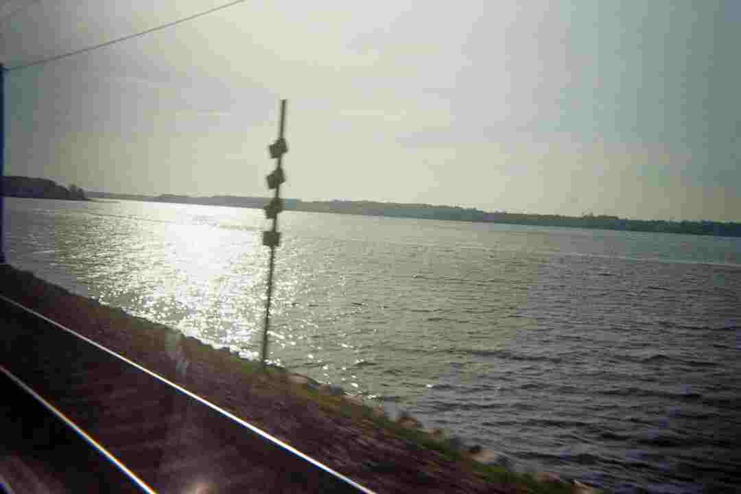 The Lillebælt seen from inside a train passing it. With strong jpg-compression artifacts.