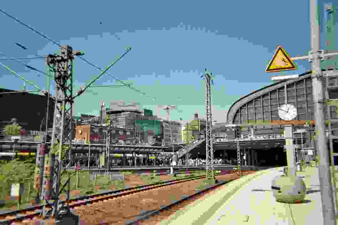 Outside platforms of Hamburg Central Station on a sunny summer day.